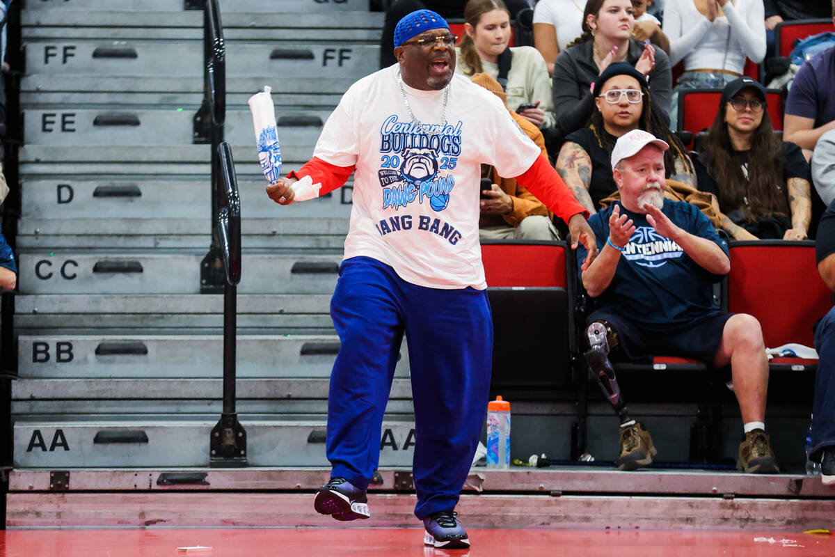 A Centennial fan cheers during a class 5A girls basketball state championship game between Cent ...