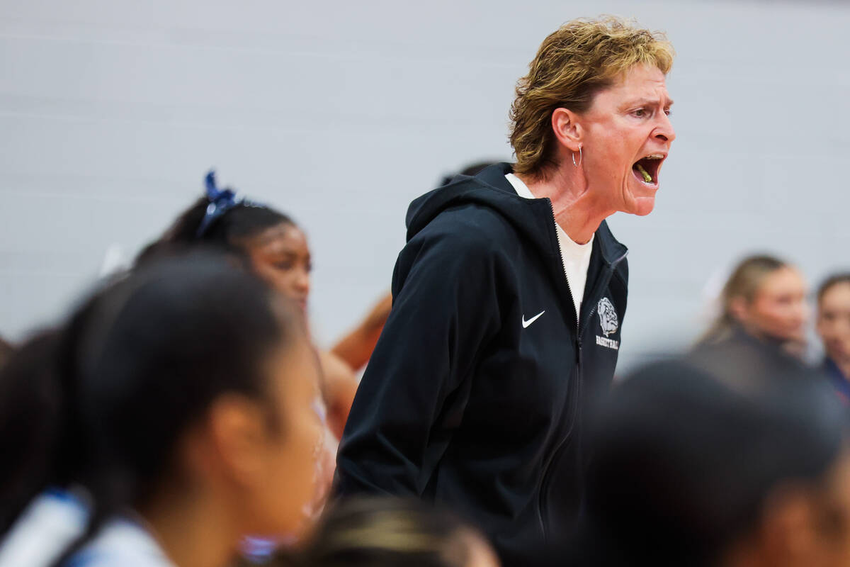 Centennial head coach Karen Weitz coaches fro the sidelines during a class 5A girls basketball ...