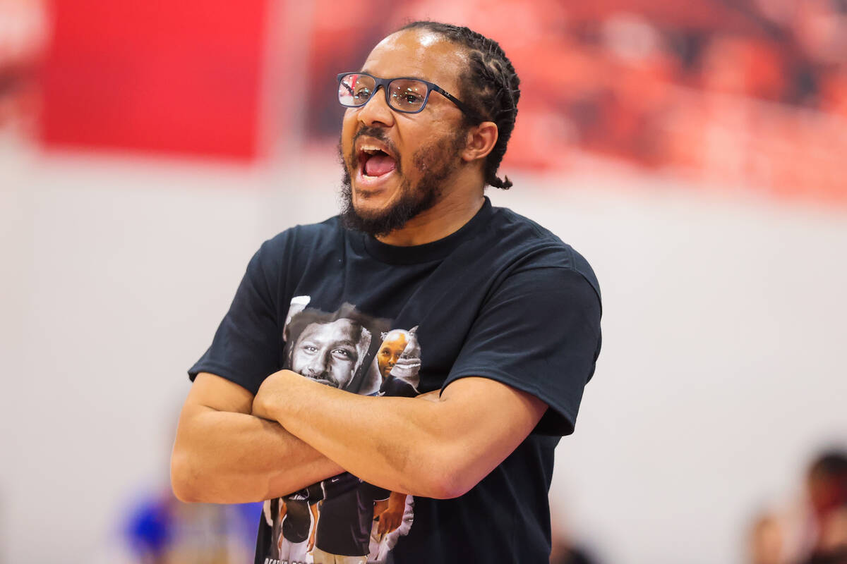 Democracy Prep head coach Julius Barren coaches from the sidelines during a class 5A girls bask ...