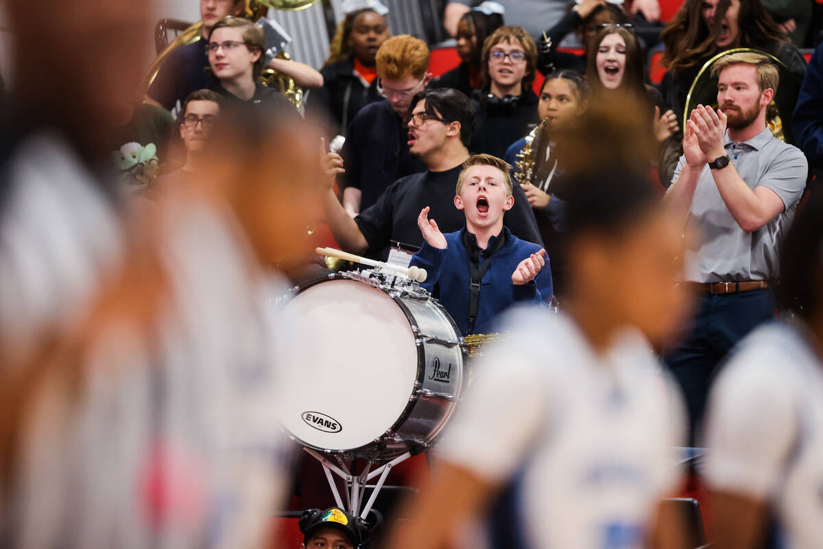 Members of the Centennial band cheer during a class 5A girls basketball state championship game ...
