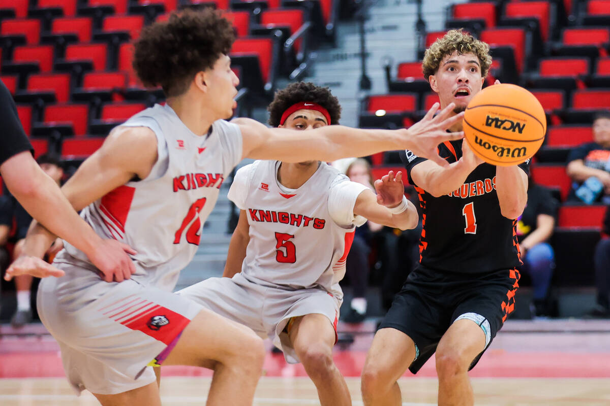 Fernley’s Bryce Dunagan-Stephens (1) passes off the ball during a class 3A boys basketba ...