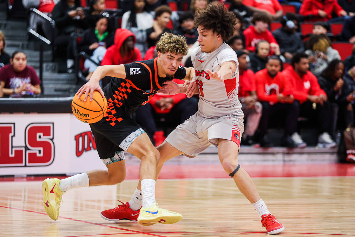 Mater East guard Deven Taylor (21) guards Fernley’s Bryce Dunagan-Stephens (1) during a ...