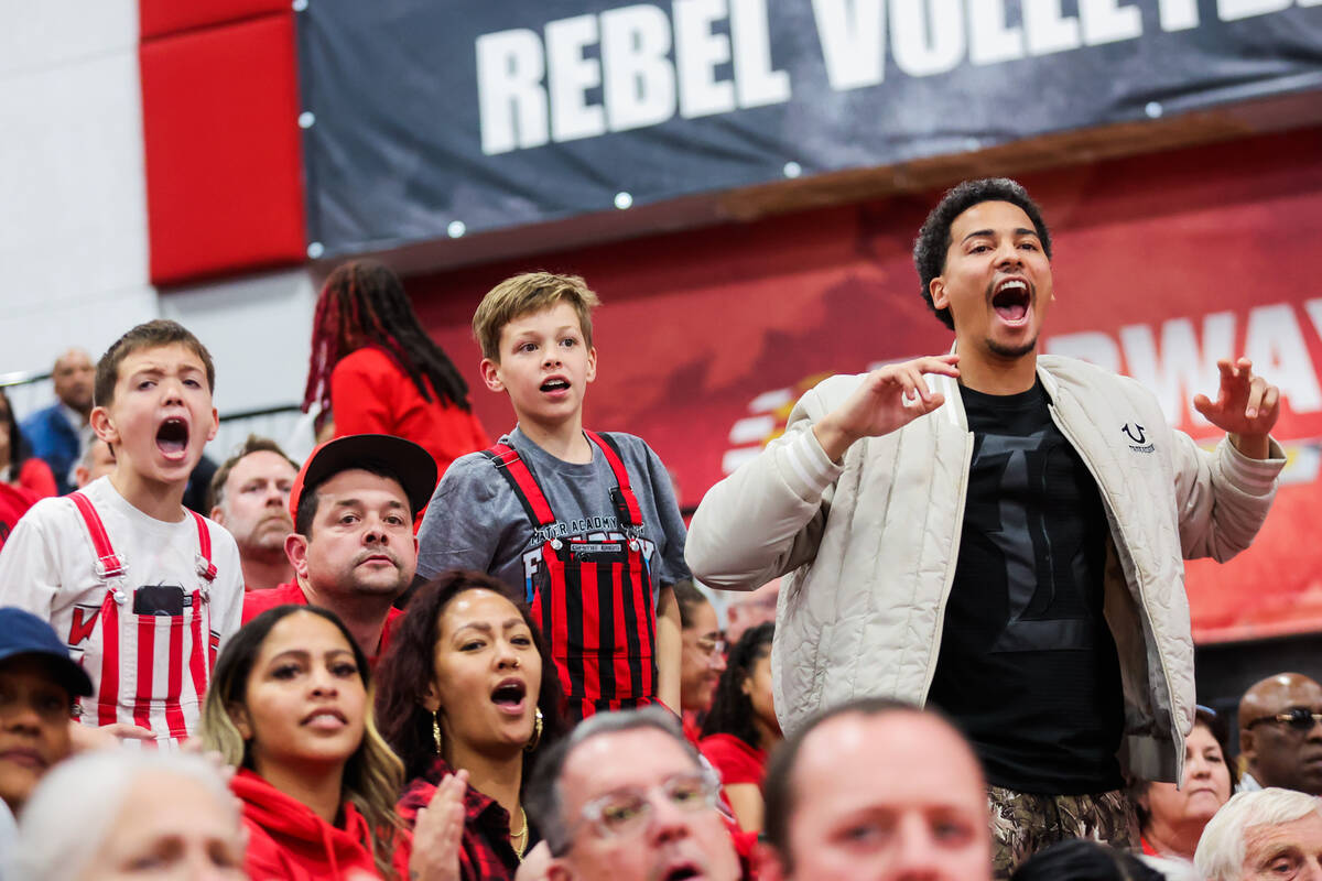 Mater East fans react to game action during a class 3A boys basketball state championship game ...