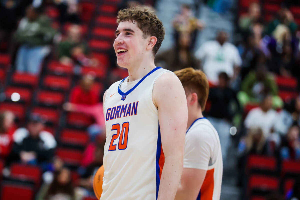 Bishop Gorman teammates celebrate winning a class 5A boys basketball state championship game be ...