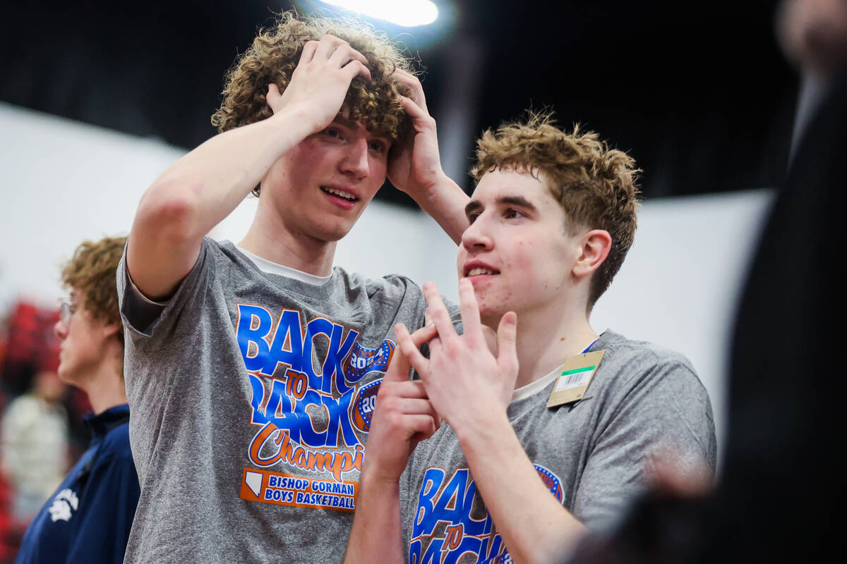 Bishop Gorman teammates celebrate winning a class 5A boys basketball state championship game be ...