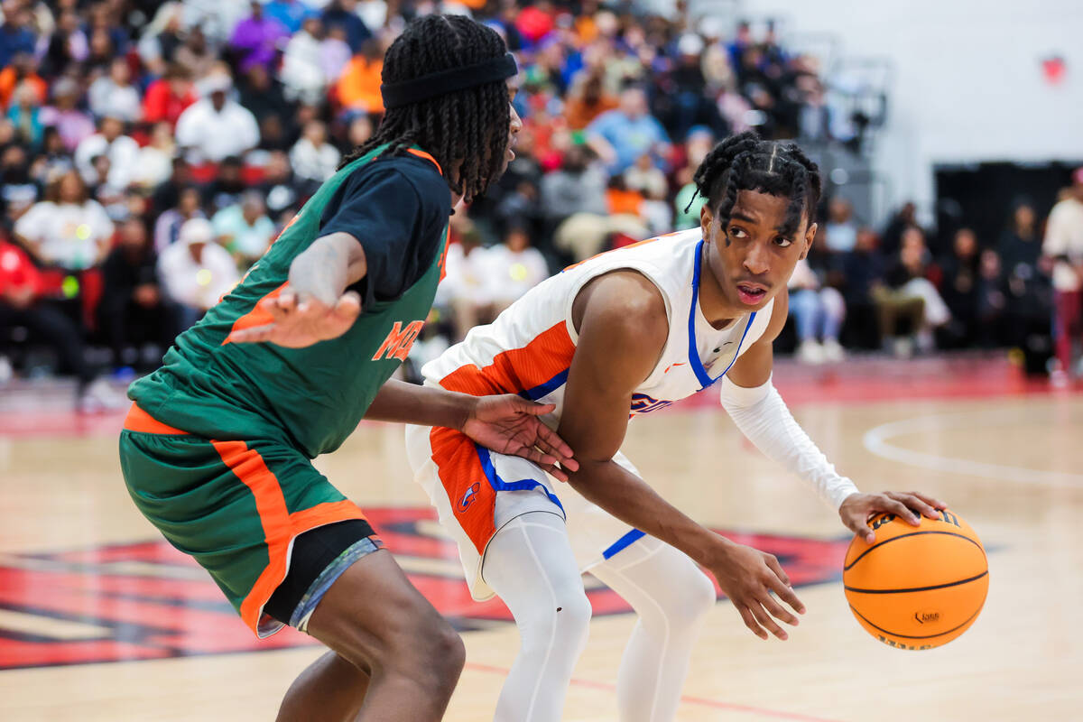 Bishop Gorman guard Nick Jefferson (10) dribbles the ball during a class 5A boys basketball sta ...