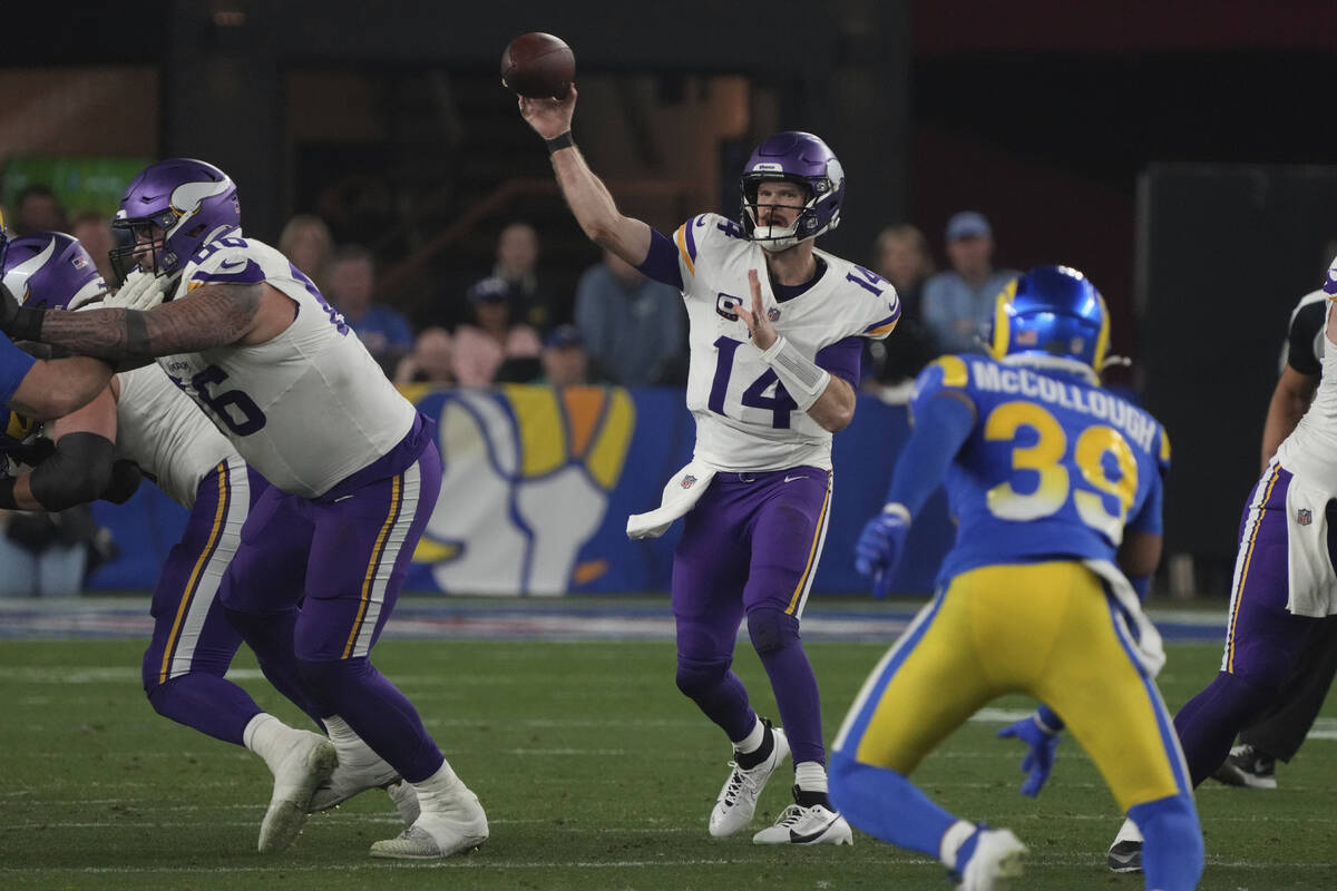 Minnesota Vikings quarterback Sam Darnold (14) looks to pass the ball against the Los Angeles R ...