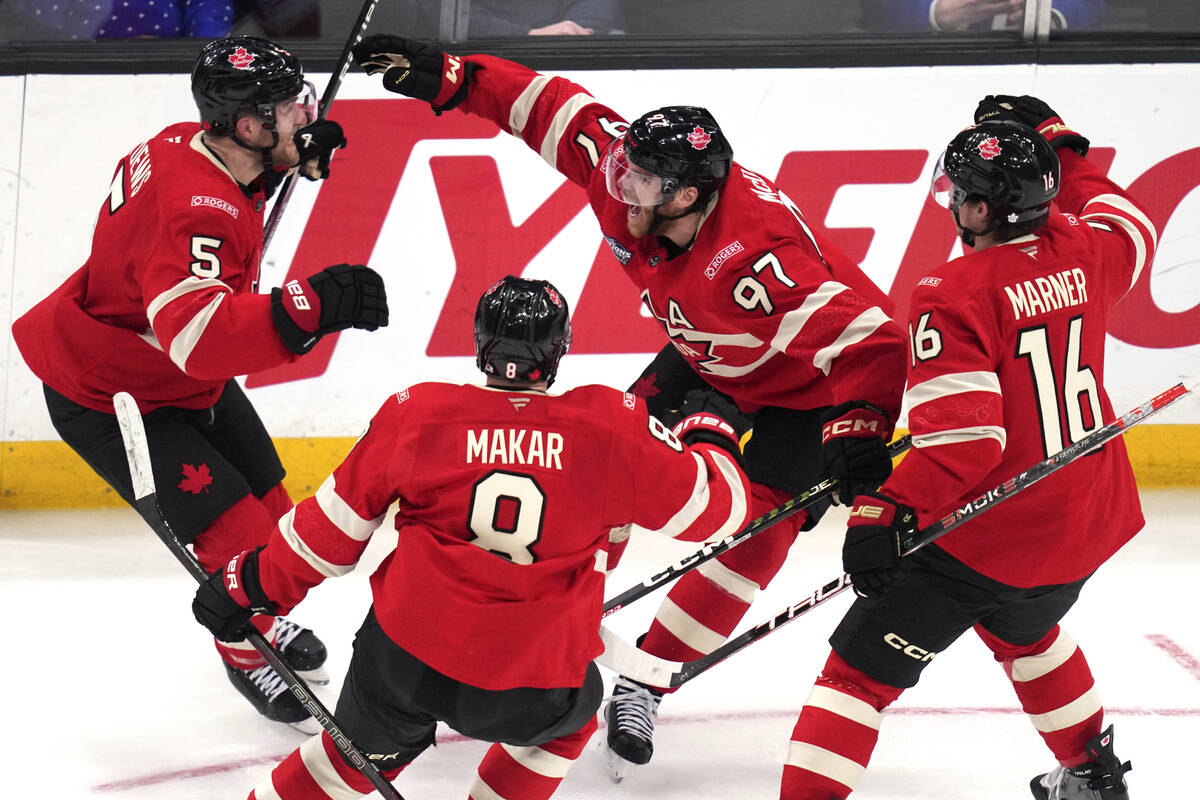 Canada's Connor McDavid (97) celebrates after his winning goal against the United States during ...