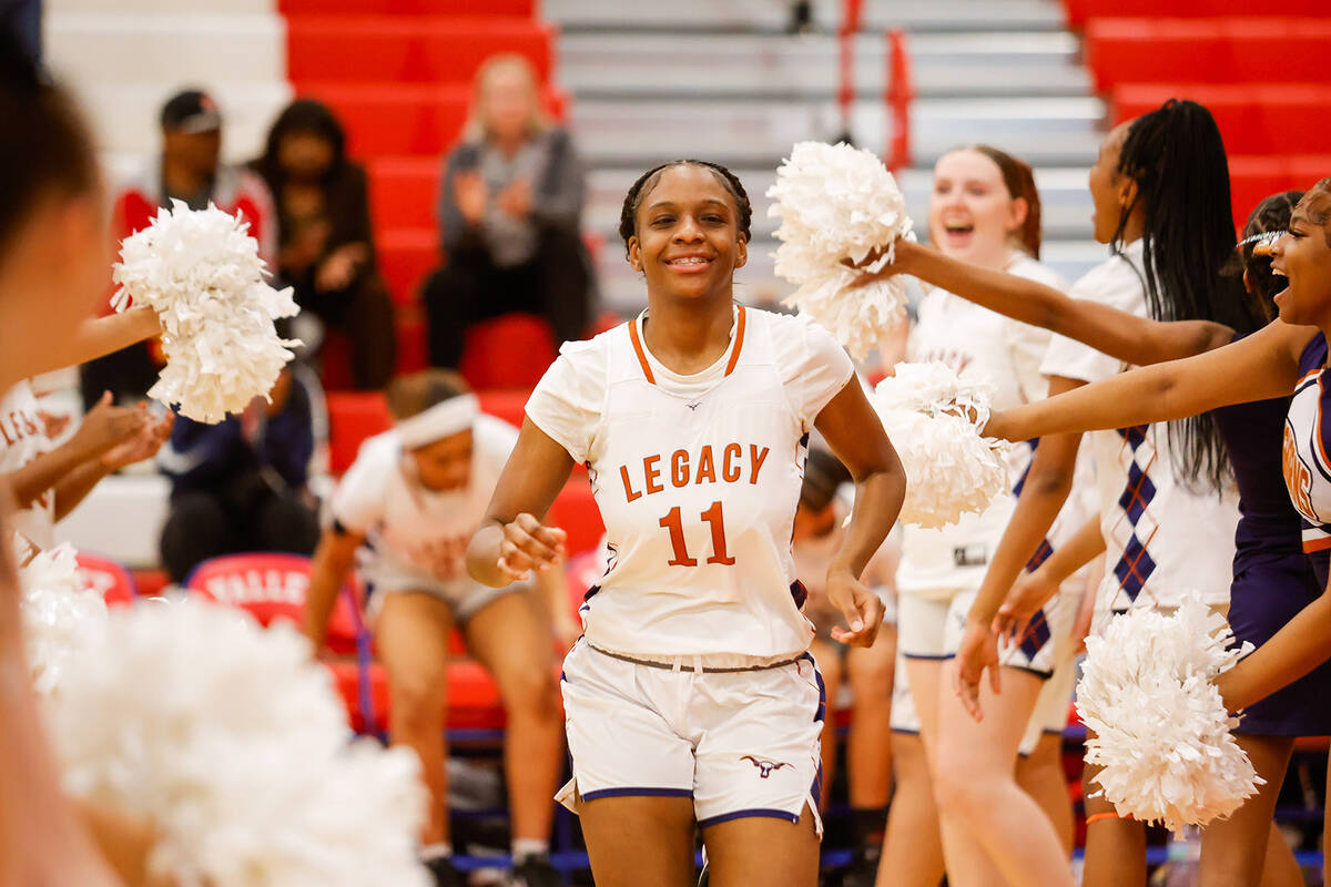 Legacy's Deshaya Hart (11) high-fives teammates during team introductions before a Class 4A gir ...