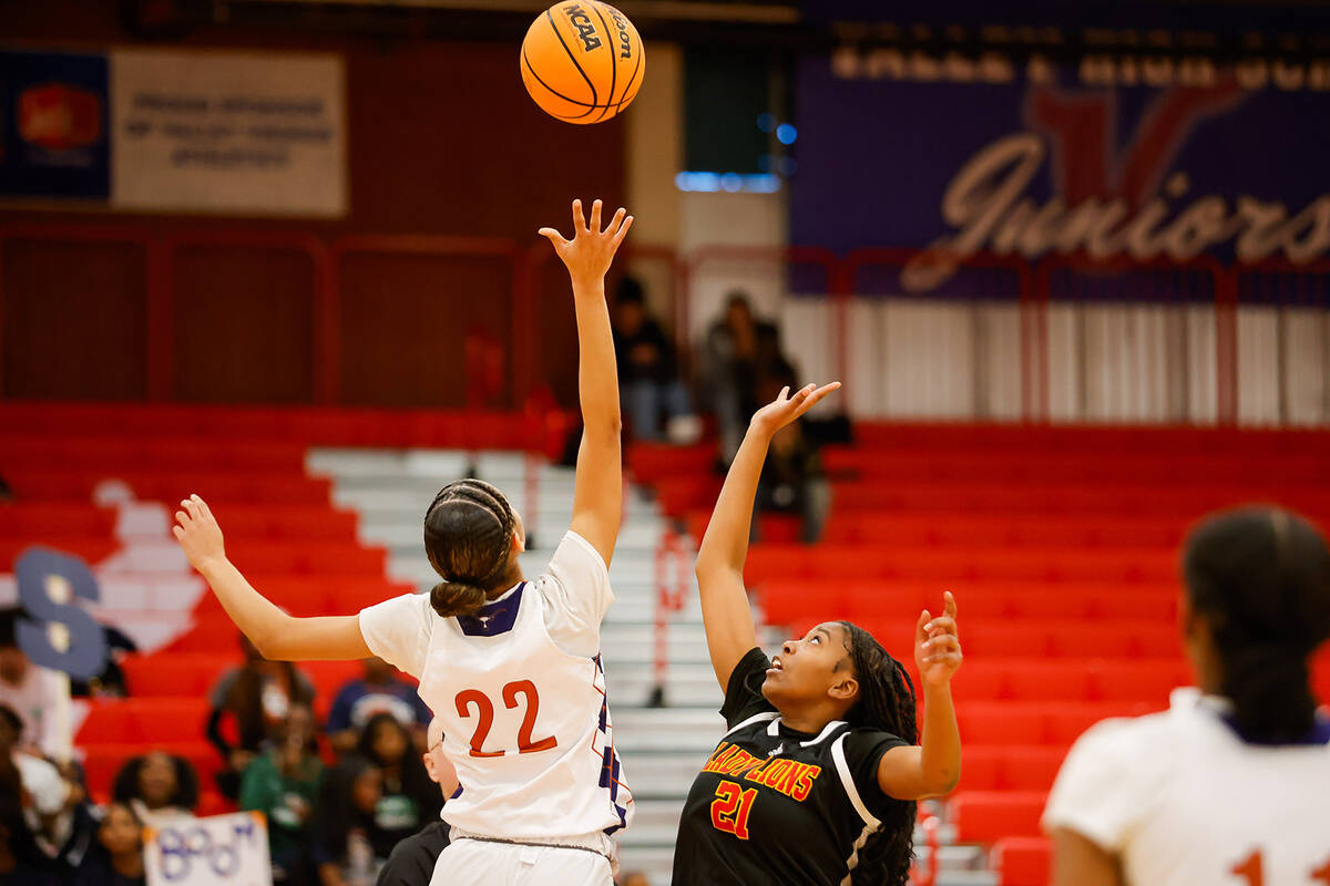 Legacy's Trista Marbry (22) and Losee's Tia Cleveland (21) jump during a jump-ball during a Cla ...