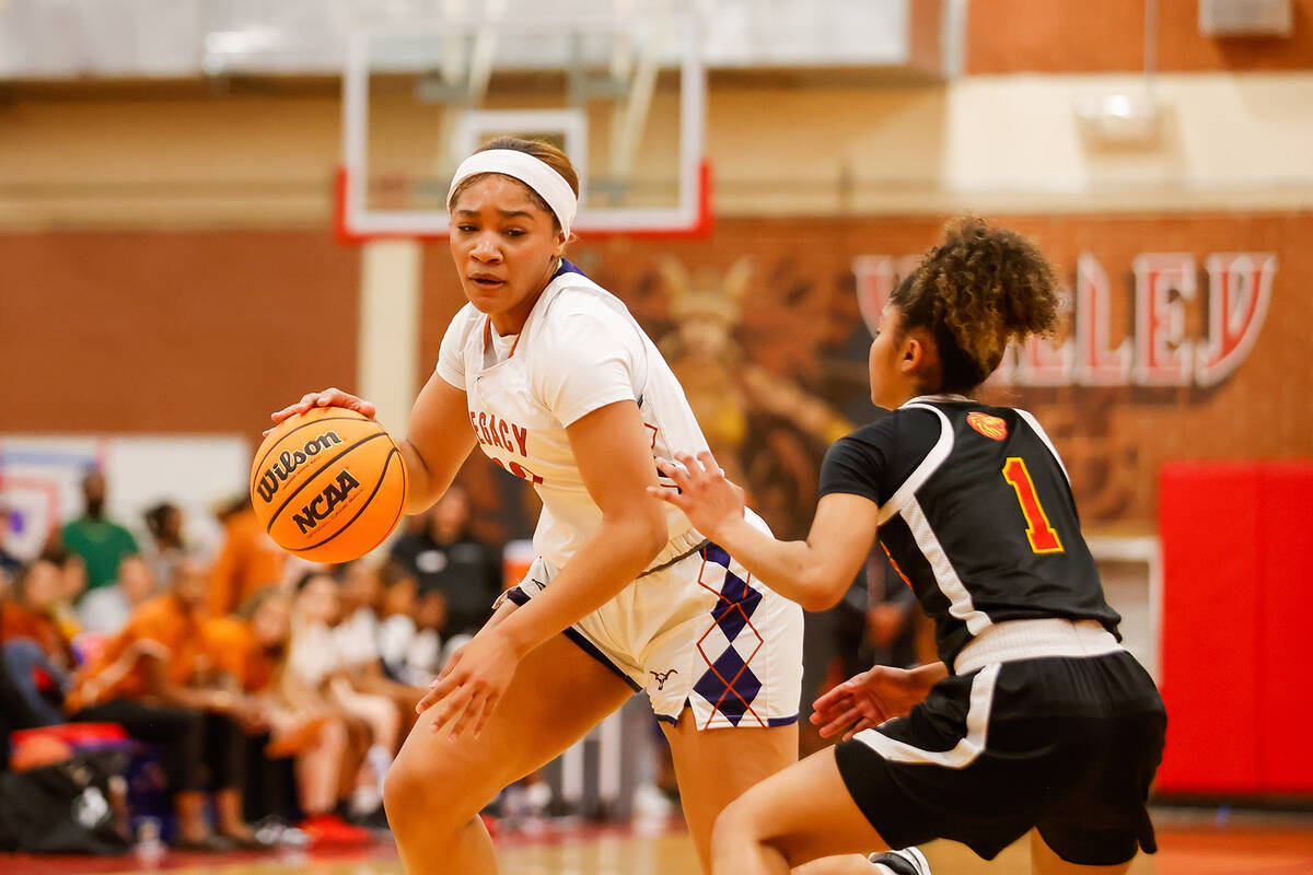 Legacy's Ajalee Williams (32) drives to the basket during a Class 4A girls basketball state sem ...