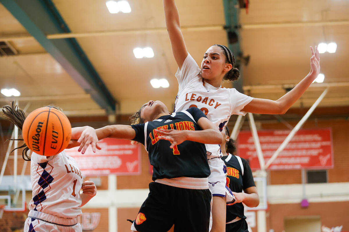 Losee guard Jayla Lewis (1) is blocked by Legacy defenders during a Class 4A girls basketball s ...