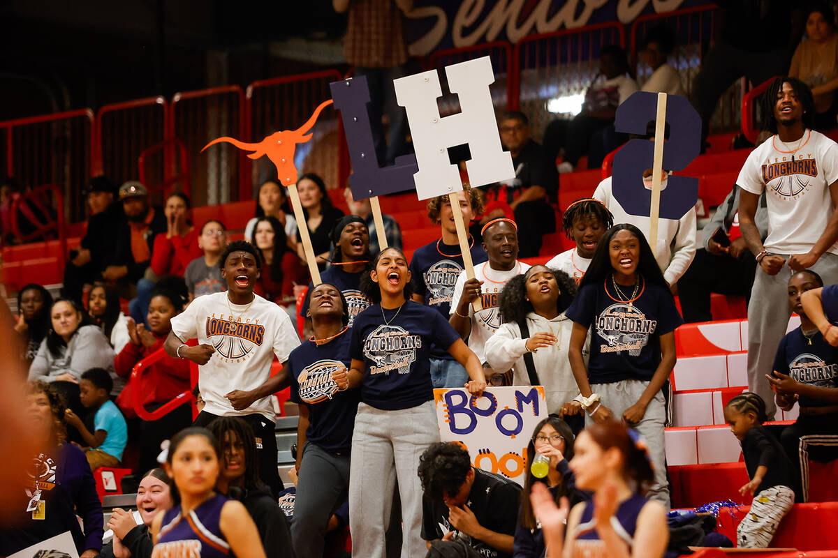 Legacy High School students cheer on the Longhorns during a Class 4A girls basketball state sem ...