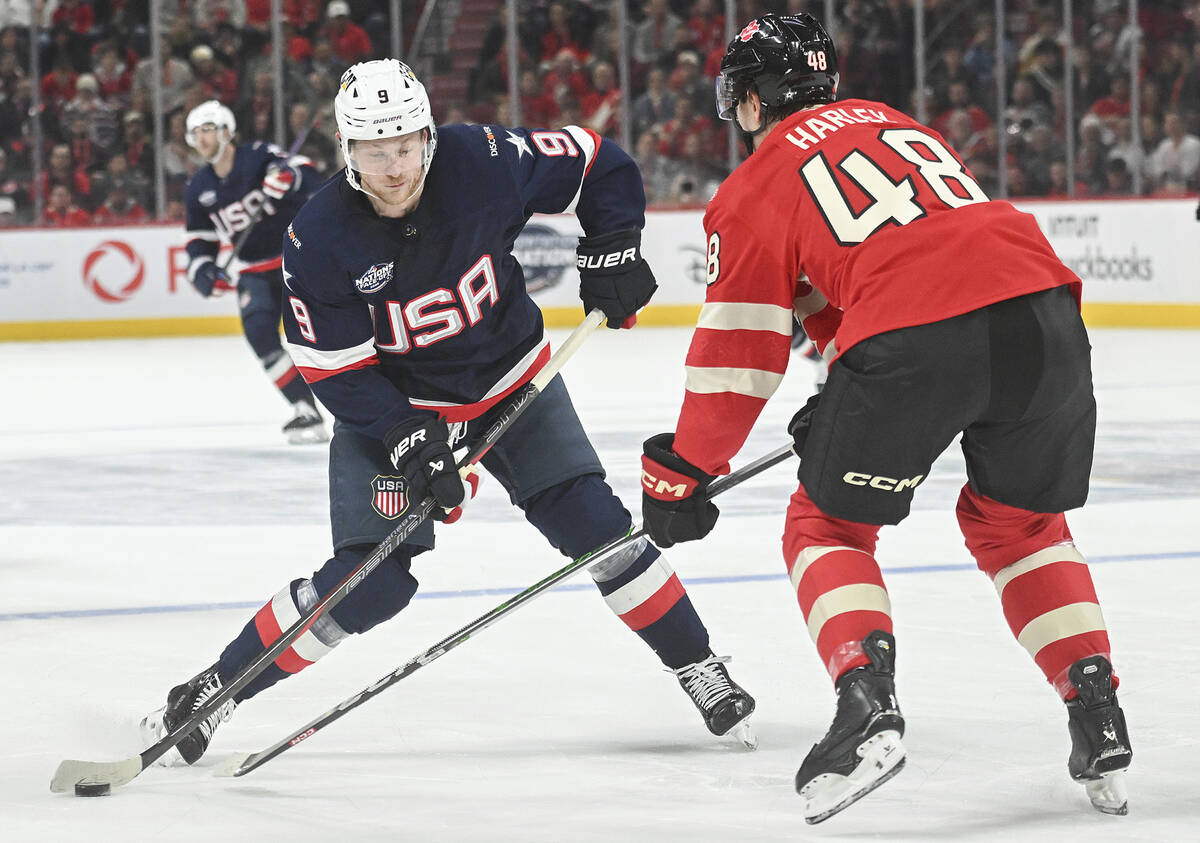United States' Jack Eichel (9) takes a shot as Canada's Thomas Harley (48) defends during secon ...