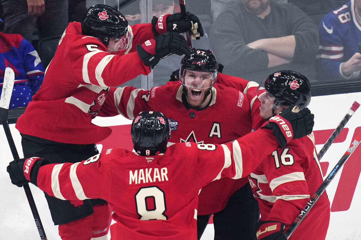 Canada's Connor McDavid (97) celebrates after his game-winning goal against the United States d ...
