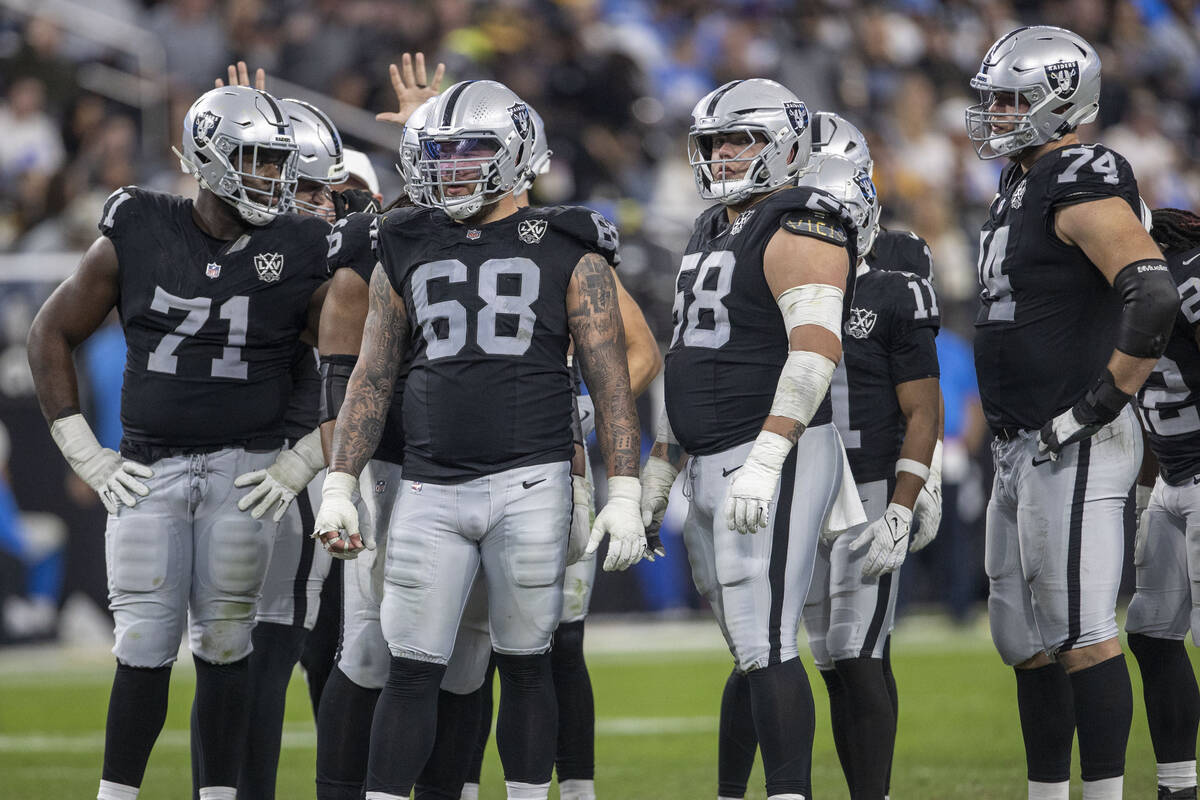 The Raiders offensive line, from left, DJ Glaze (71), Andre James (68), Jackson Powers-Johnson ...