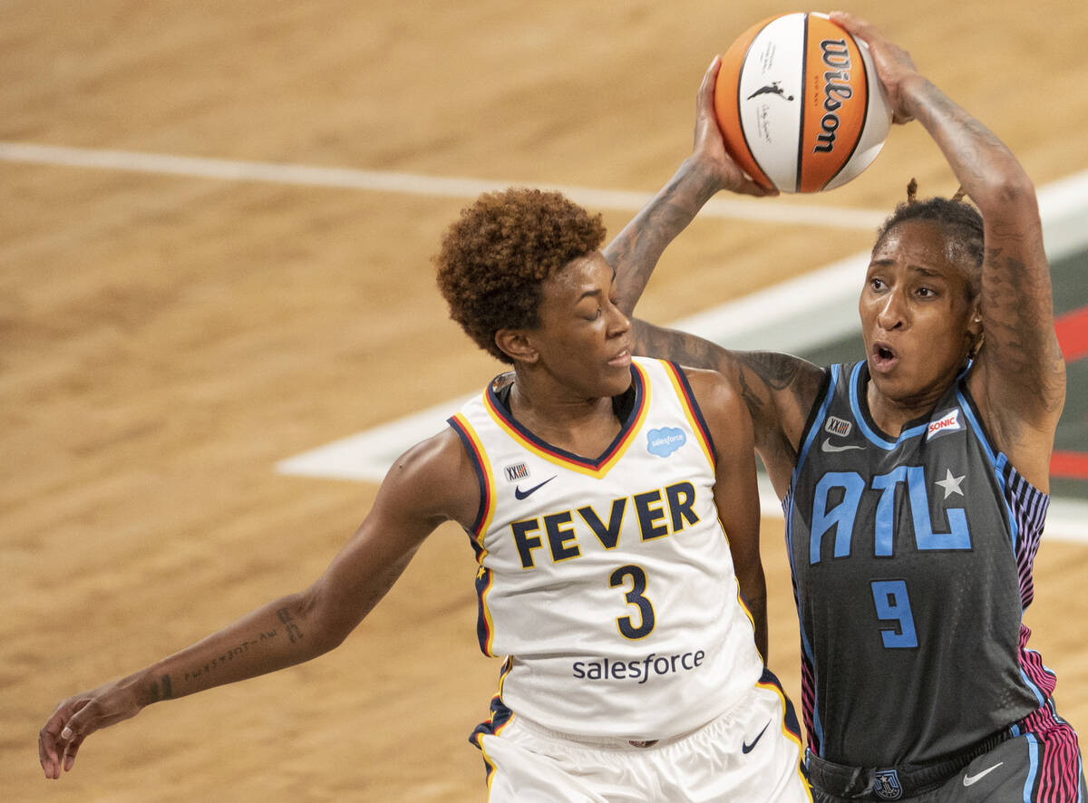 Indiana Fever guard Danielle Robinson (3) tries to defend 9 Crystal Bradford in second half of ...