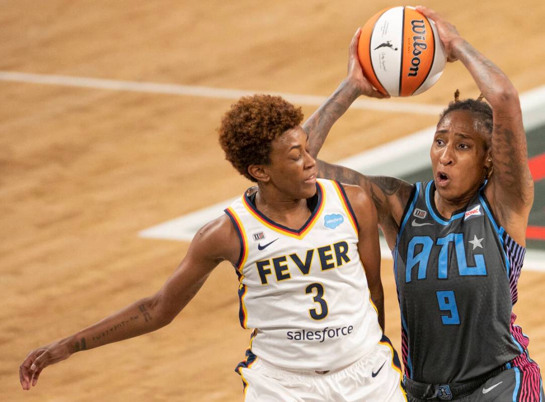 Indiana Fever guard Danielle Robinson (3) tries to defend 9 Crystal Bradford in second half of ...