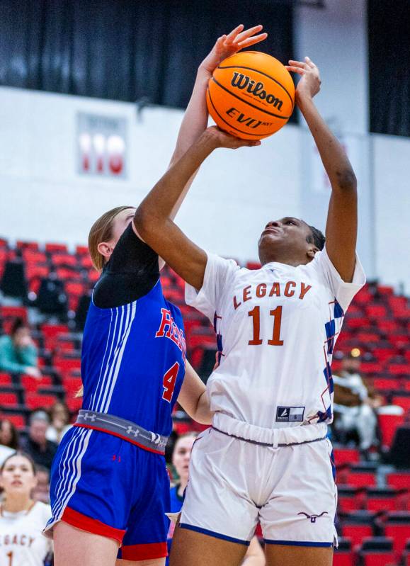 Legacy guard Deshaya Hart (11) has the shot blocked by Reno guard Brookesly Wilson (4) during t ...
