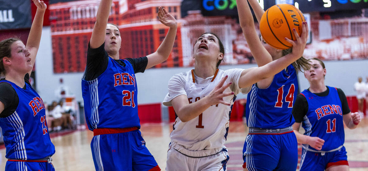 Legacy's Alabama Nieves shoots around Reno forward Eva Houston (20) during the first half of t ...
