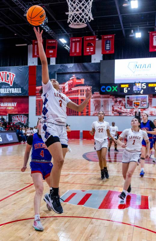 Legacy guard Laila Gines (3) lays in the ball over Reno guard Brookesly Wilson (4) during the f ...