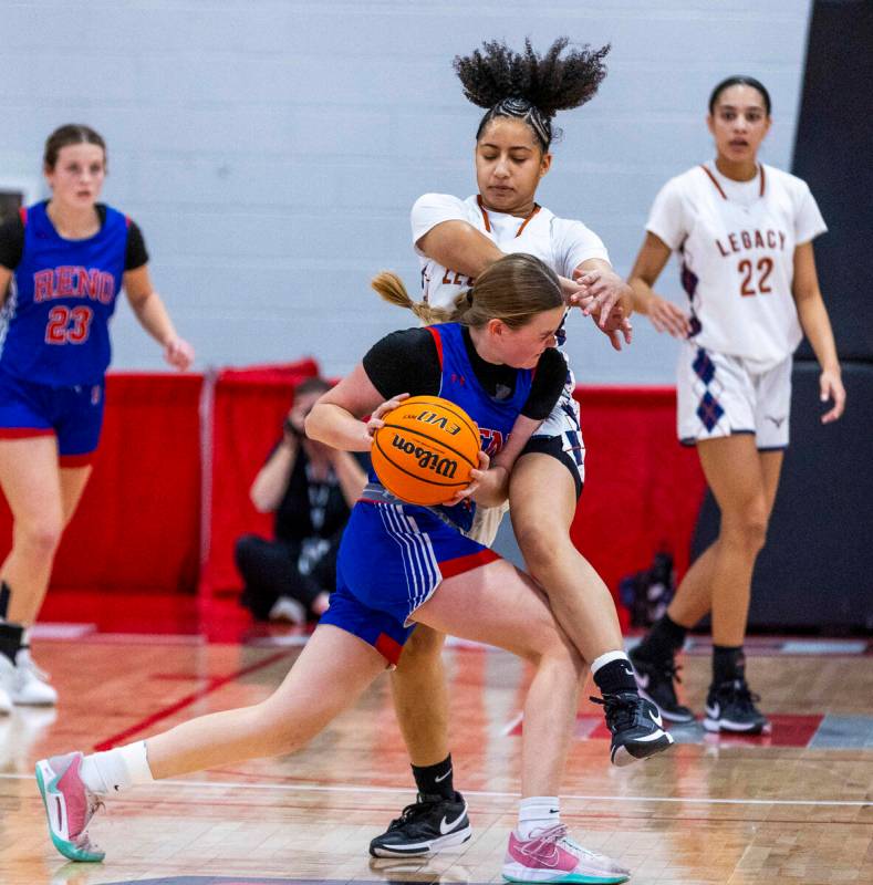 Reno guard Brookesly Wilson (4) drives hard into Legacy guard Laila Gines (3) during the first ...