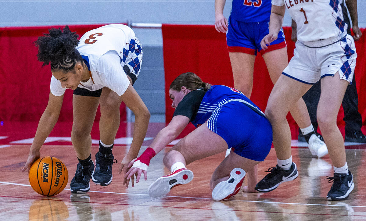 Legacy guard Laila Gines (3) grabs a loose ball away from Reno guard Violet Gordon (11) during ...
