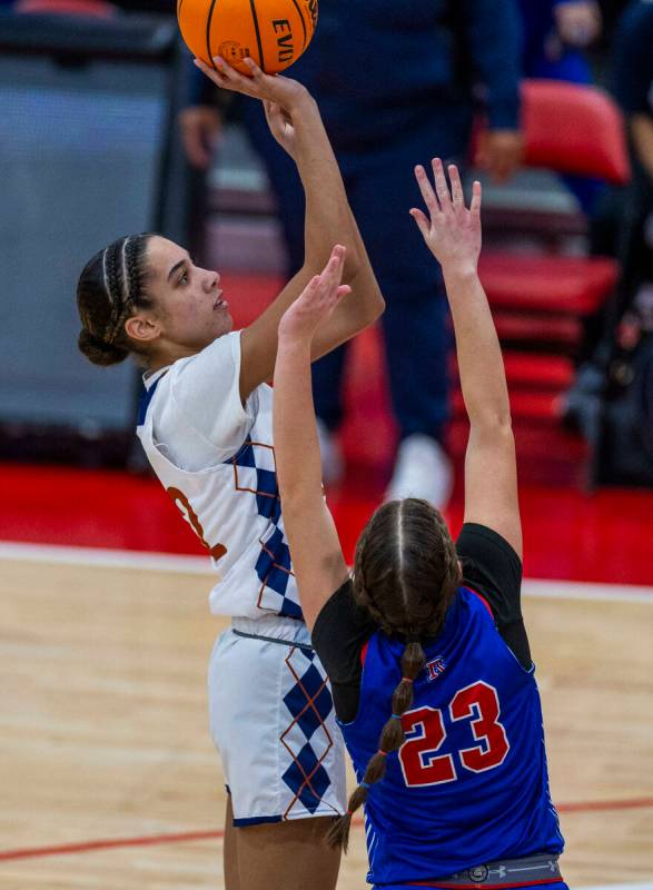 Legacy forward Trista Mabry (22) posts up for a shot over Reno forward Natalia Schettler (23) d ...