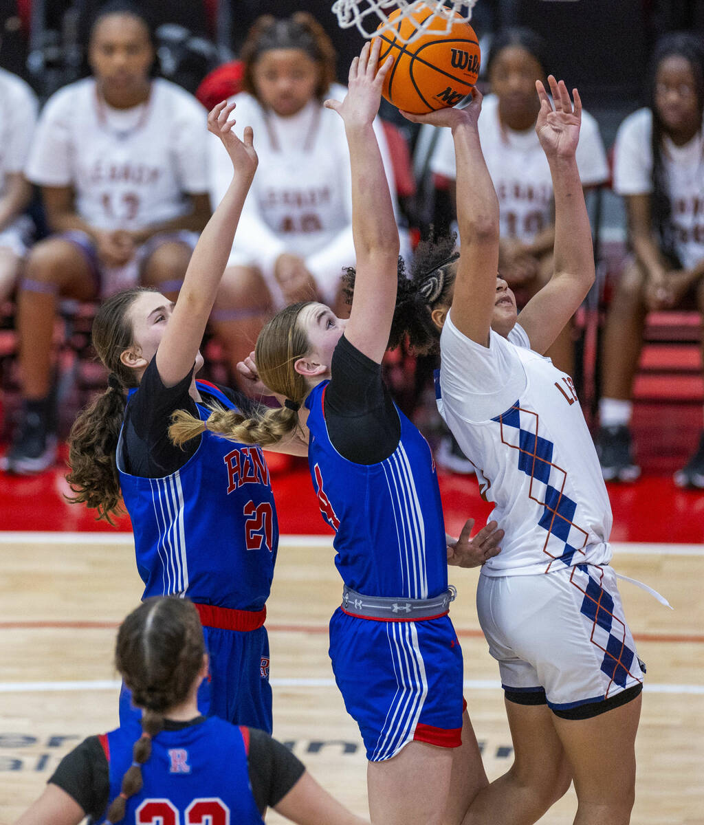 Legacy guard Laila Gines (3) has the shot blocked from behind by Reno guard Brookesly Wilson (4 ...