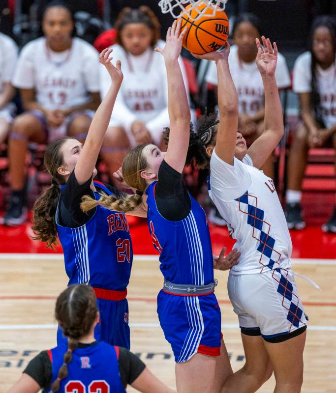 Legacy guard Laila Gines (3) has the shot blocked from behind by Reno guard Brookesly Wilson (4 ...