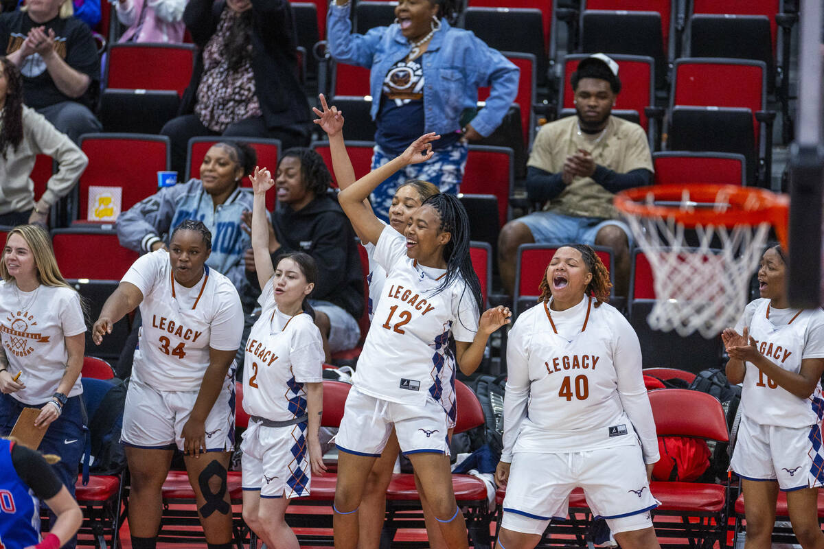 Legacy teammates cheer another three-point basket against Reno during the second half of their ...