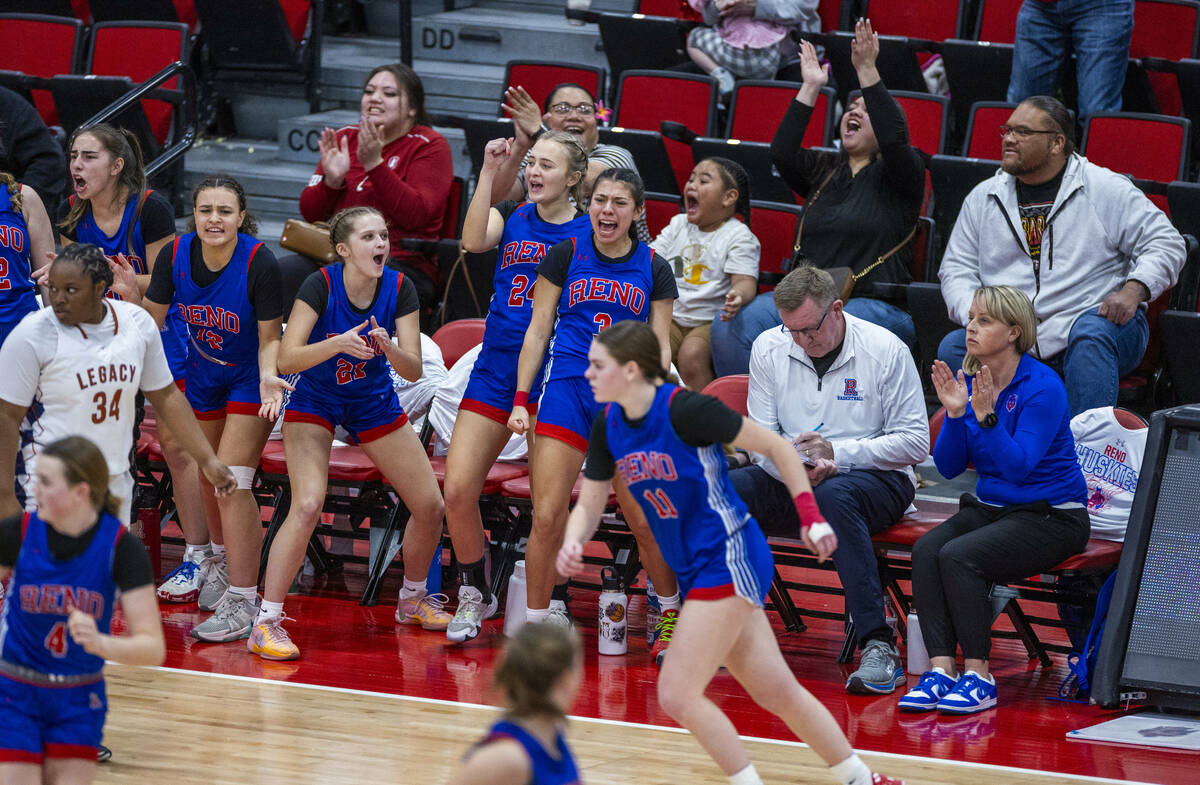 Reno teammates cheer for a score over Legacy during the second half of their 4A girls basketbal ...