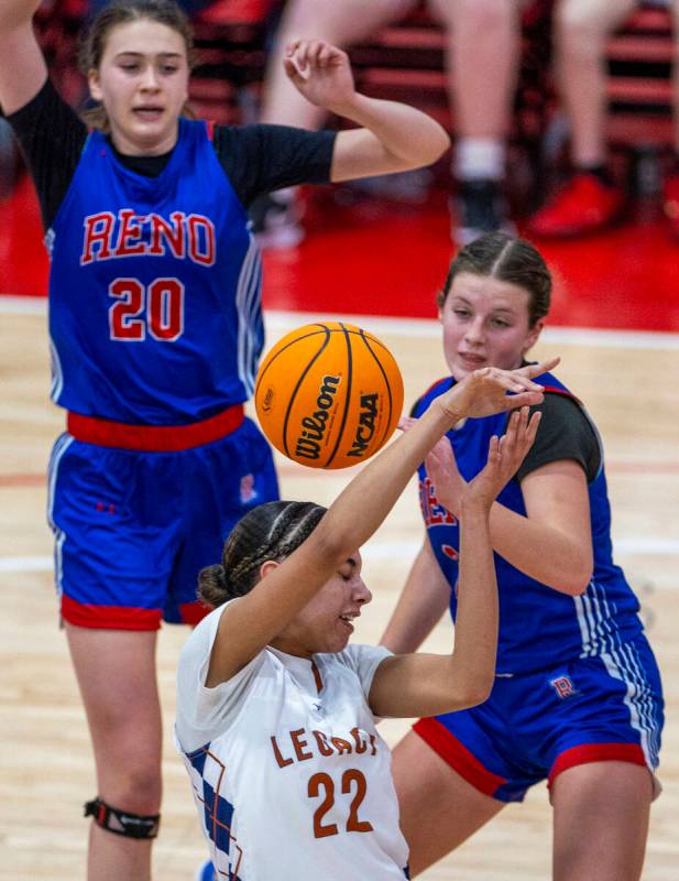 Legacy forward Trista Mabry (22) has a ball bounce off her head as Reno forward Natalia Schettl ...