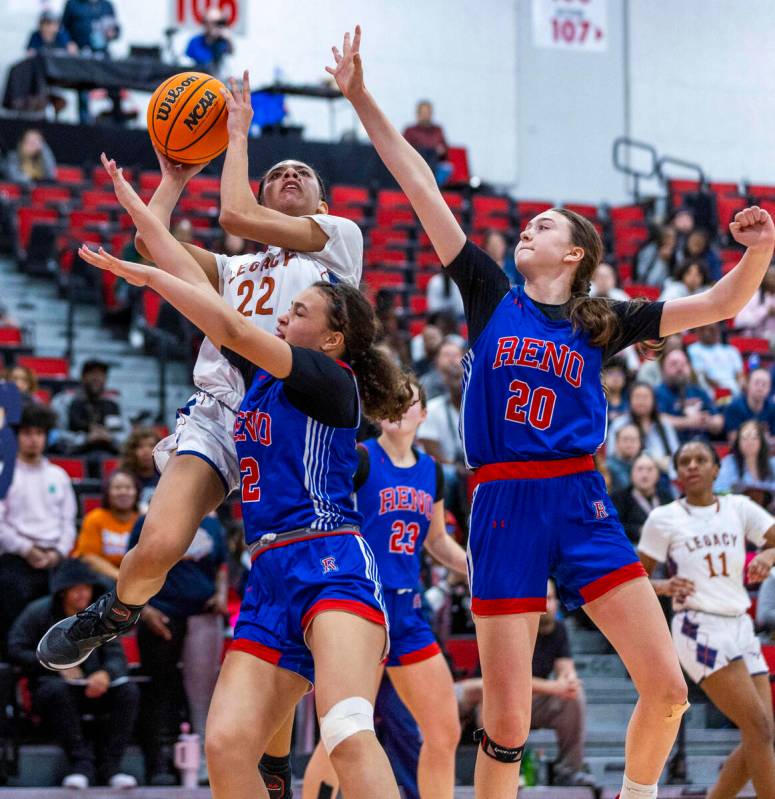 Legacy forward Trista Mabry (22) shoots over Reno forward Asha Maryott (12) and forward Eva Hou ...