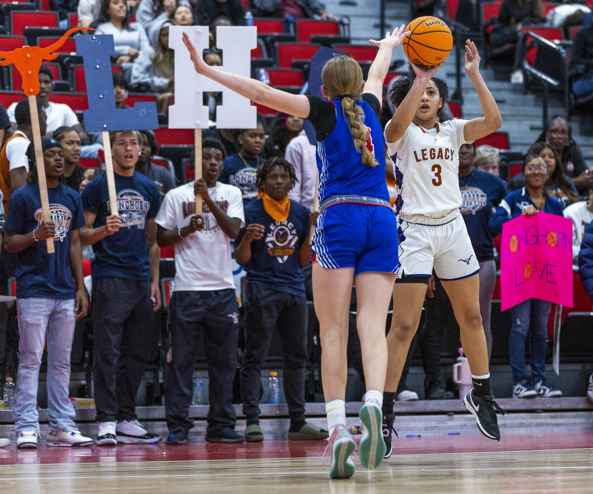 Legacy guard Laila Gines (3) shoots a three-point basket over Reno guard Brookesly Wilson (4) R ...