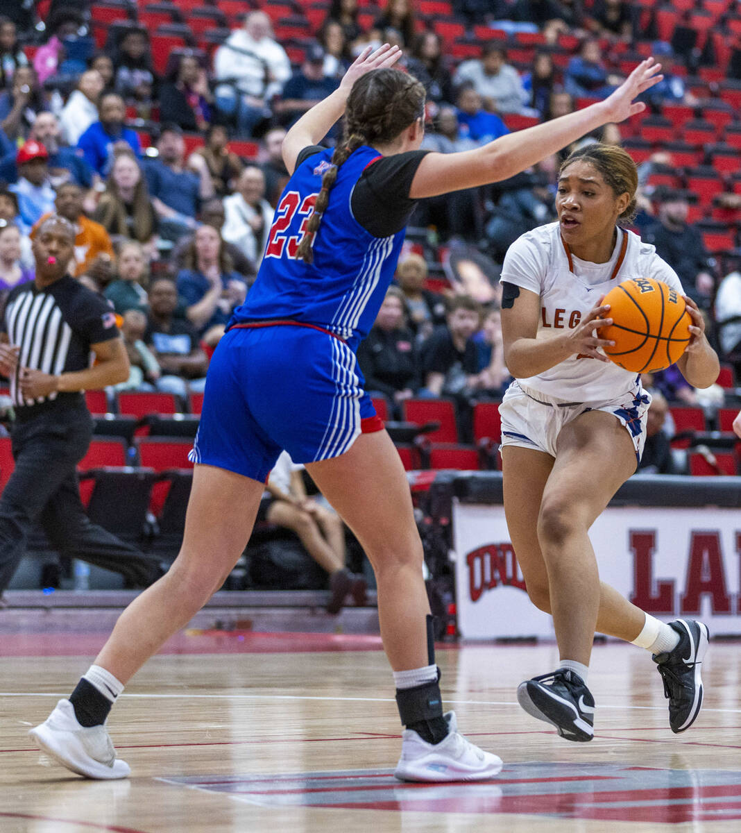 Reno forward Natalia Schettler (23) looks to block a drive by Legacy forward Ajalee Williams (3 ...
