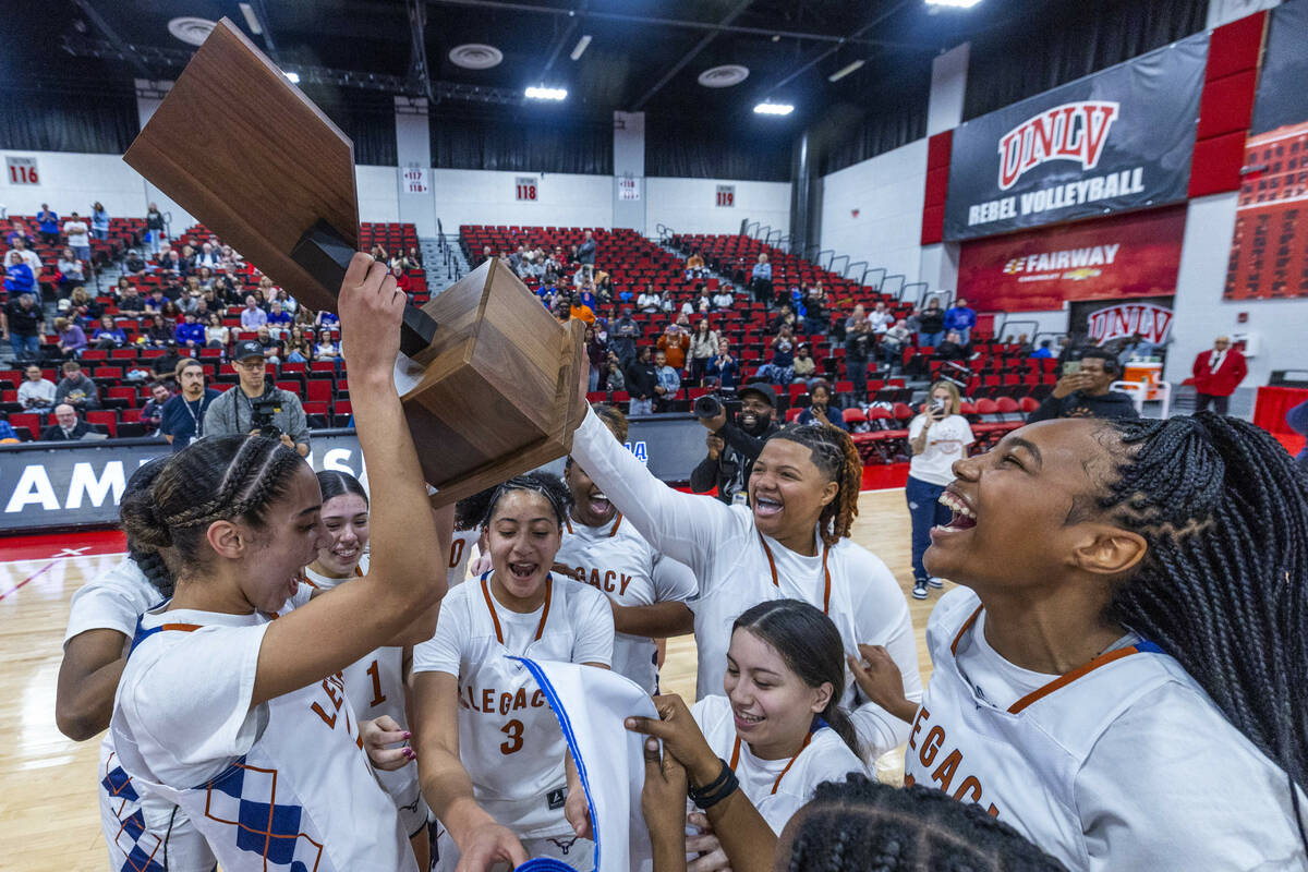 Legacy teammates celebrate their win over Reno during their 4A girls basketball state champions ...