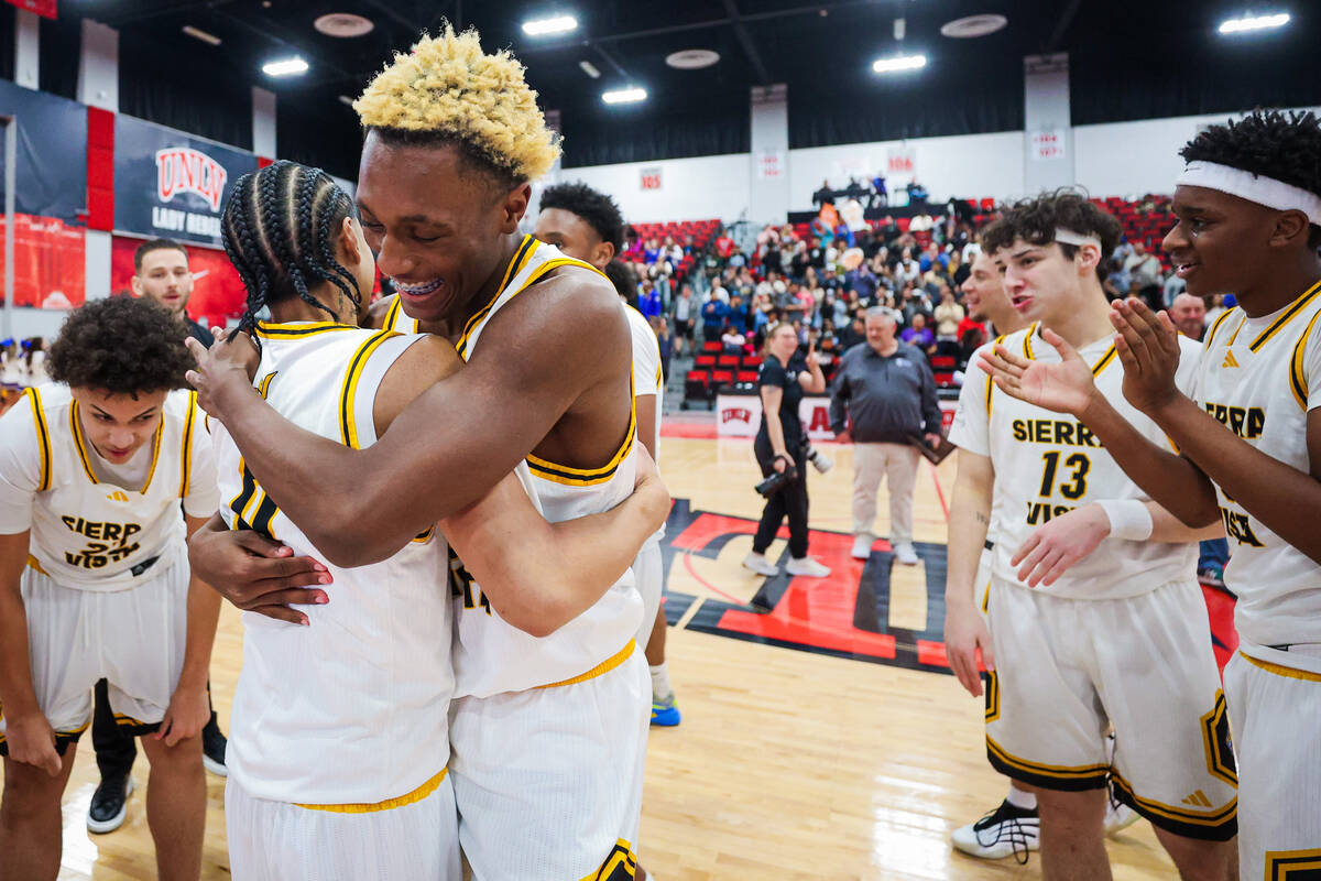 Sierra Vista players celebrate after winning a class 4A boys basketball state championship game ...