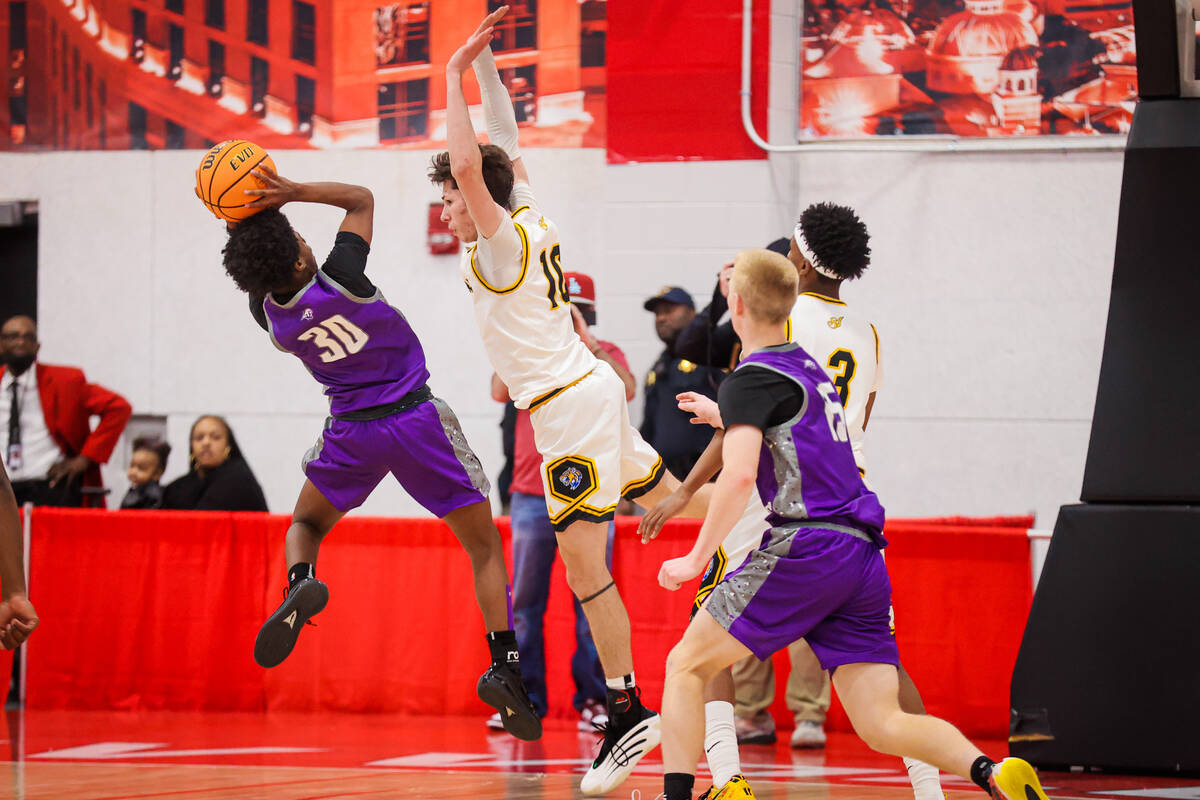 Spanish Springs point guard Ja'shon Ervin-Franklin (30) puts up a shot against Sierra Vista for ...