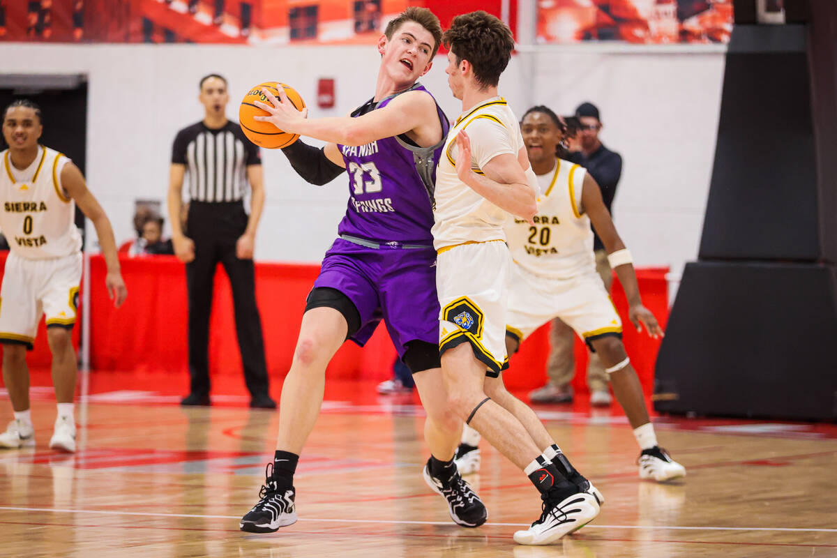 Spanish Spring center Jackson Flint (33) looks for an open teammate as Sierra Vista forward Col ...