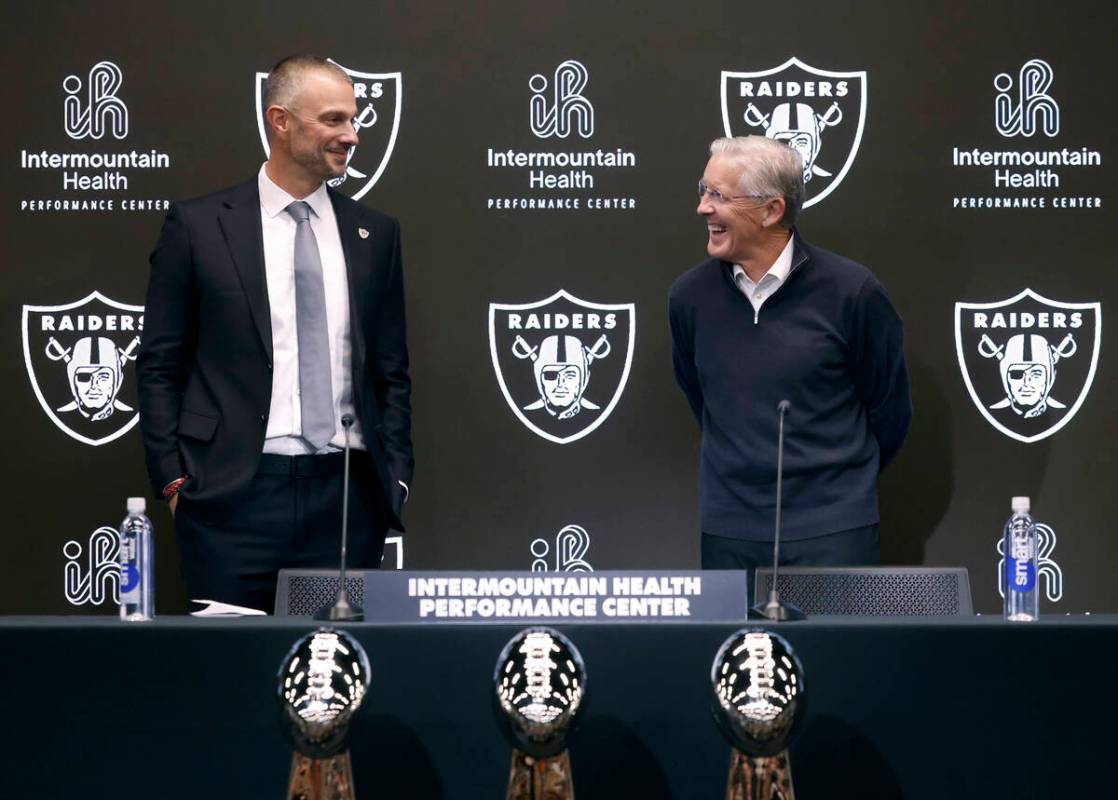 The new Raiders general manager John Spytek, left, and new head coach Pete Carroll share laught ...