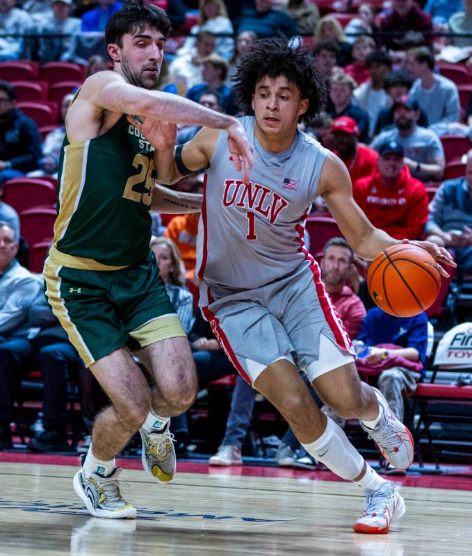 UNLV forward Jalen Hill (1) attempts to drive the line against Colorado State Rams guard Ethan ...