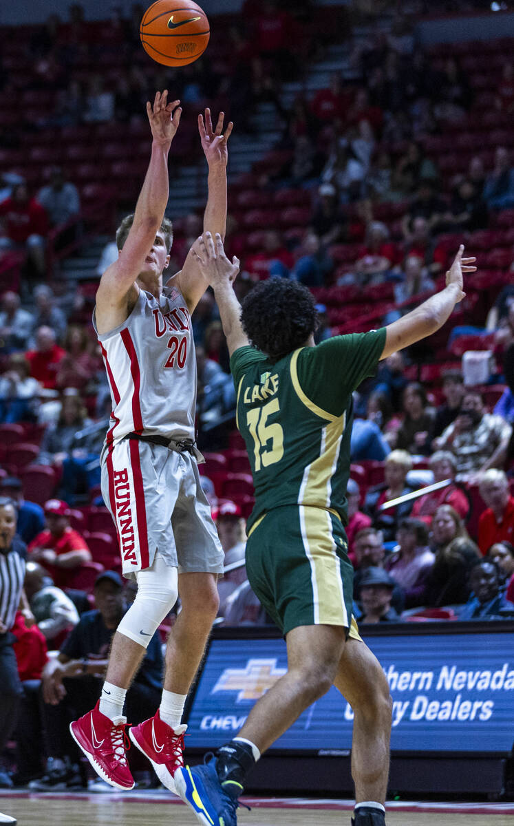 UNLV guard Julian Rishwain (20) shoots a three-point basket over Colorado State Rams guard Jale ...