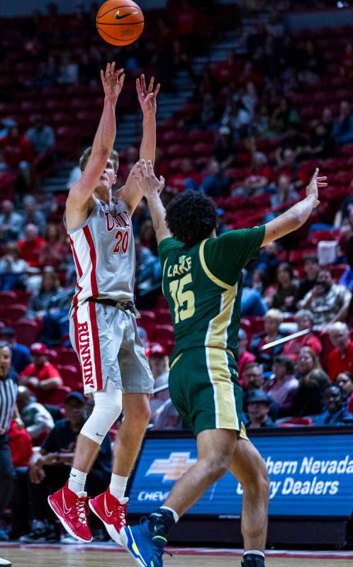 UNLV guard Julian Rishwain (20) shoots a three-point basket over Colorado State Rams guard Jale ...