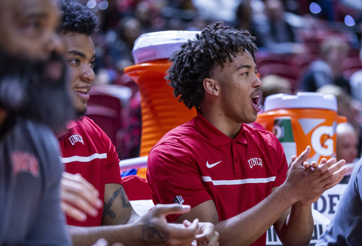 UNLV guard Dedan Thomas Jr. (11) cheers for his teammates from the bench against the Colorado S ...
