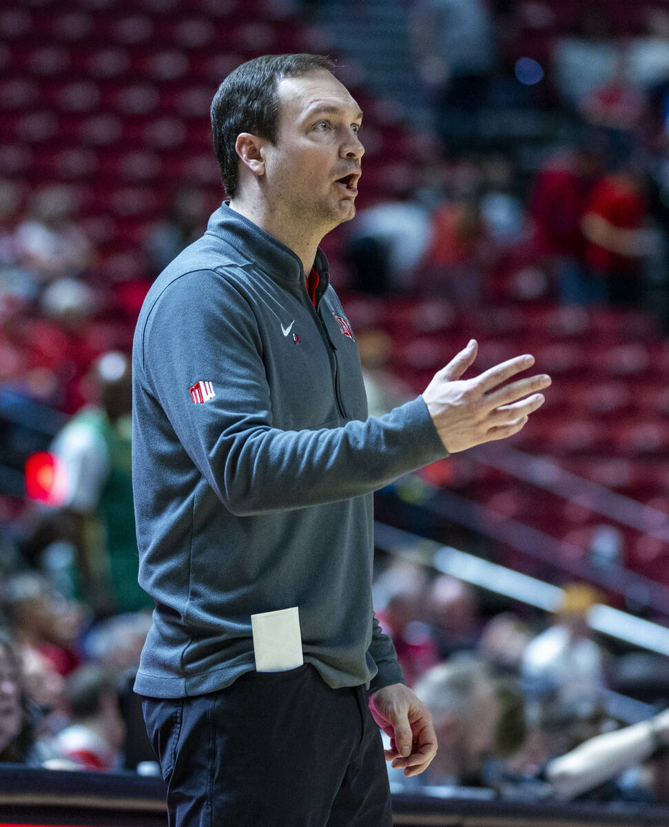 UNLV head coach Kevin Kruger relays in a play to his team against the Colorado State Rams durin ...