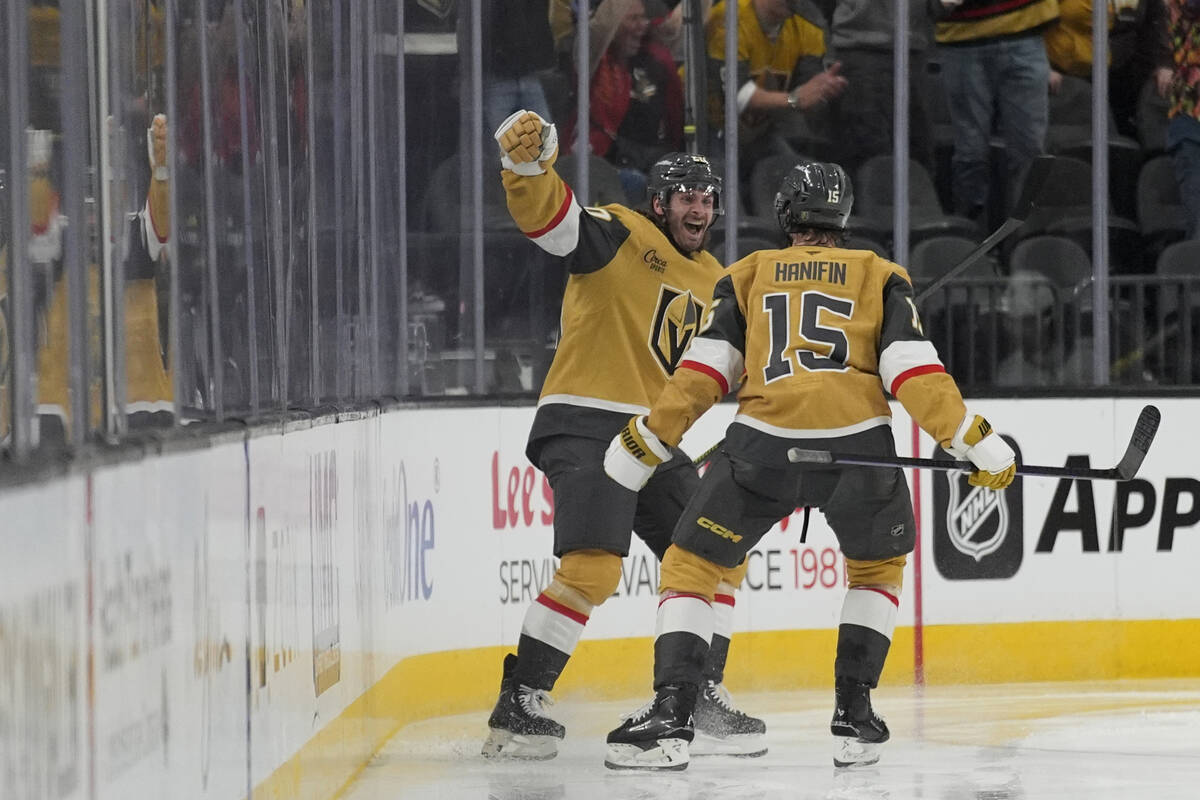 Vegas Golden Knights left wing Brandon Saad, left, celebrates after scoring against the Vancouv ...