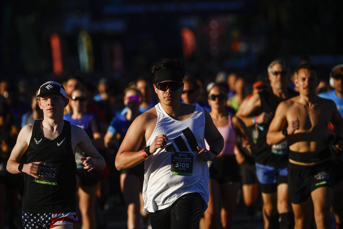 Race participants take off from the start line outside of the New York-New York during the Rock ...
