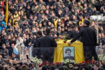 A trailer carrying the coffins containing the bodies of Hezbollah's former leader Hassan Nasral ...