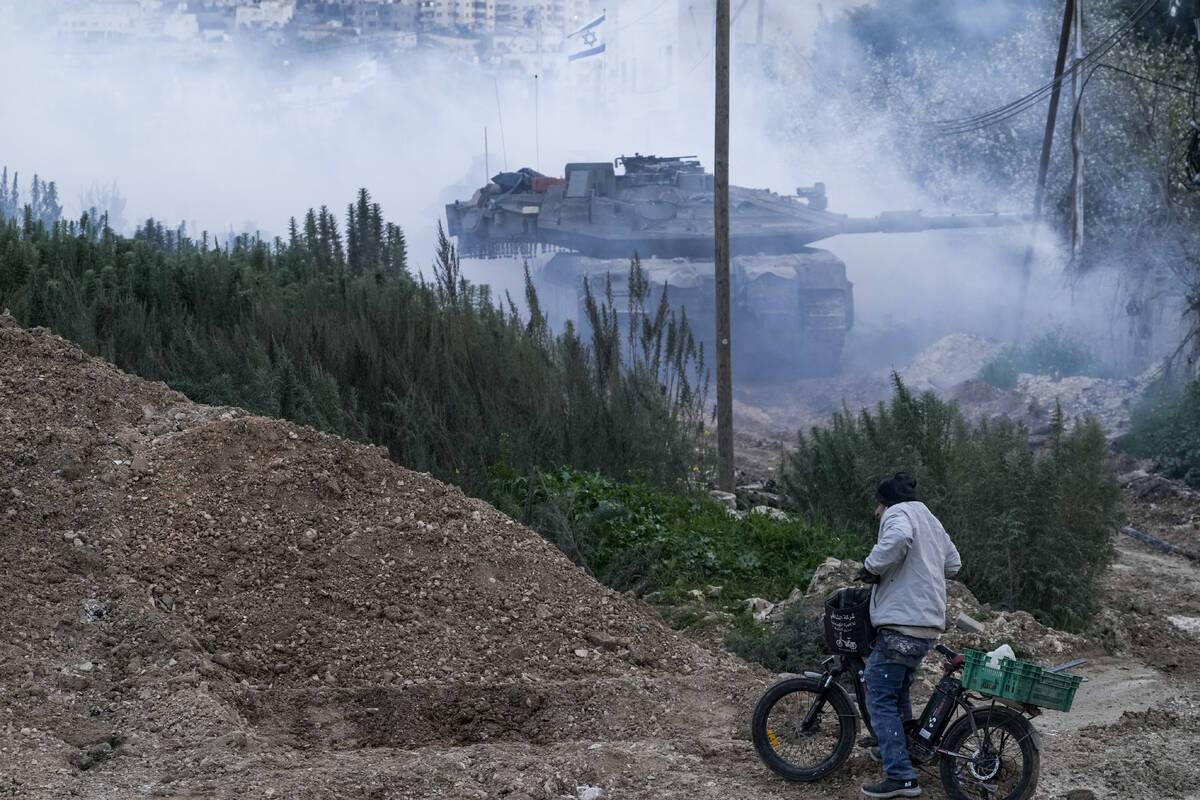Israeli tanks moving into the Palestinians city of Jenin in the occupied West Bank, Sunday, Feb ...